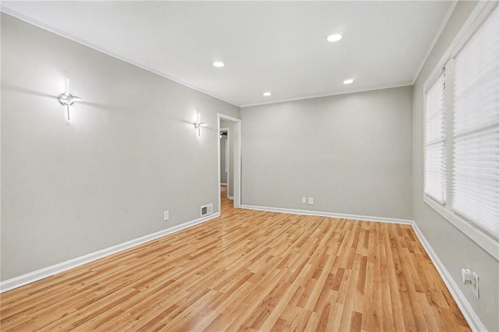 2912 Belvedere Lane Decatur, GA 30032 - Photo 6 of 25 a view of empty room with wooden floor and fan