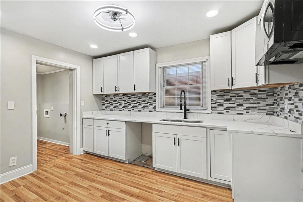2912 Belvedere Lane Decatur, GA 30032 - Photo 8 of 25 a kitchen with granite countertop a sink and cabinets
