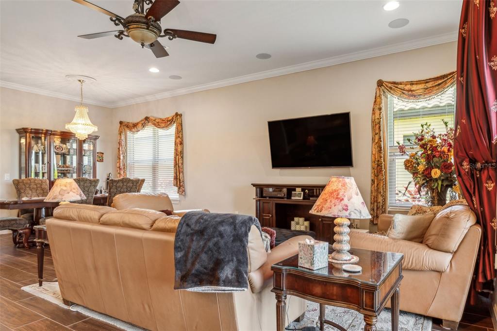 8530 Grand Alberato Road Tampa, FL 33647 - Photo 12 of 67 a living room with furniture and a flat screen tv