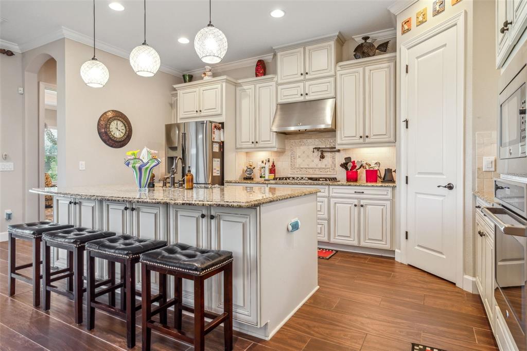 8530 Grand Alberato Road Tampa, FL 33647 - Photo 15 of 67 a kitchen with stainless steel appliances granite countertop a stove a sink and a refrigerator