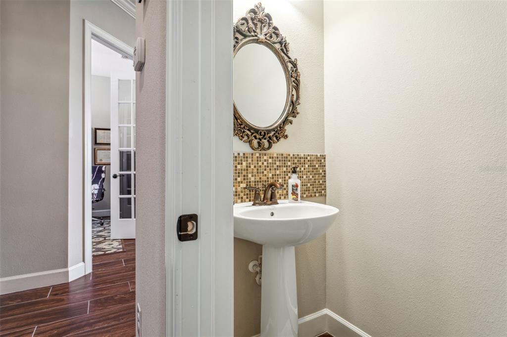 8530 Grand Alberato Road Tampa, FL 33647 - Photo 19 of 67 a bathroom with a sink and a mirror