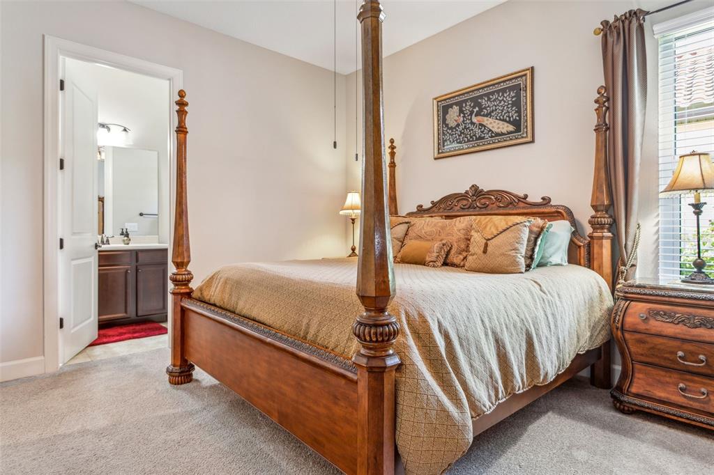 8530 Grand Alberato Road Tampa, FL 33647 - Photo 20 of 67 a bedroom with a bed and window