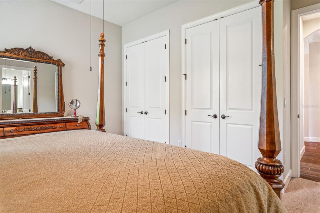 8530 Grand Alberato Road Tampa, FL 33647 - Photo 21 of 67 a bedroom with a bed and a mirror