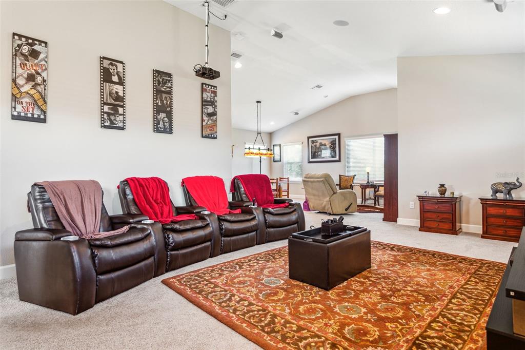 8530 Grand Alberato Road Tampa, FL 33647 - Photo 26 of 67 a living room with furniture a rug and a couch