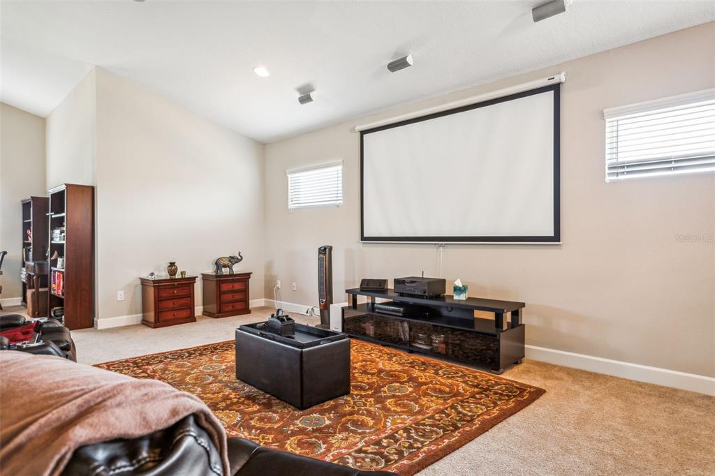 8530 Grand Alberato Road Tampa, FL 33647 - Photo 27 of 67 a living room with furniture and a flat screen tv
