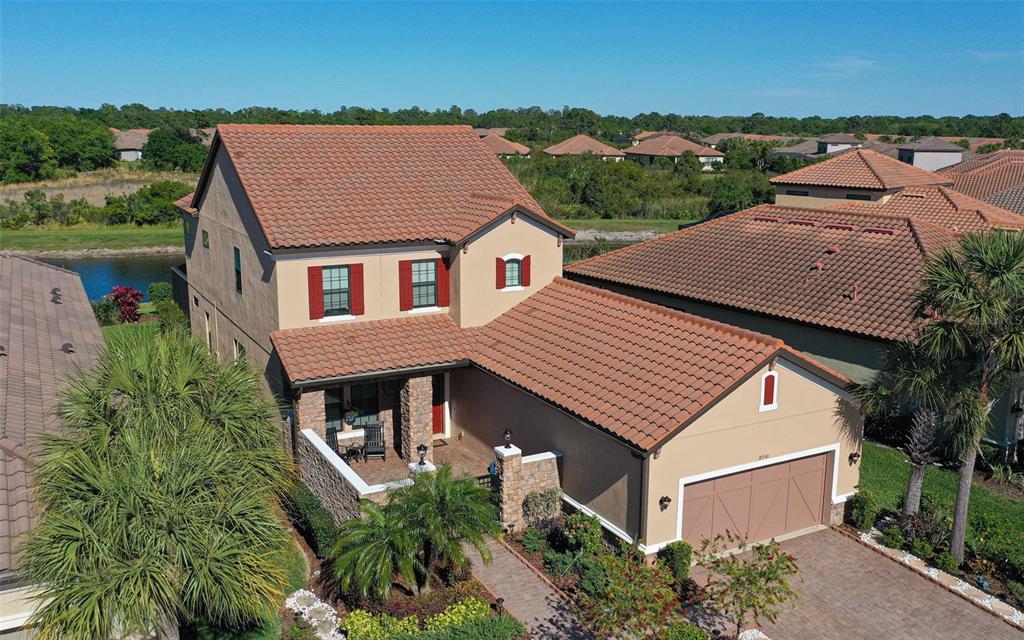 8530 Grand Alberato Road Tampa, FL 33647 - Photo 4 of 67 an aerial view of a house with a yard