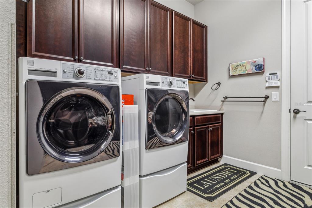 8530 Grand Alberato Road Tampa, FL 33647 - Photo 41 of 67 a utility room with dryer and washer