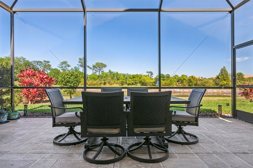 8530 Grand Alberato Road Tampa, FL 33647 - Photo 43 of 67 a view of a chairs and table in the patio