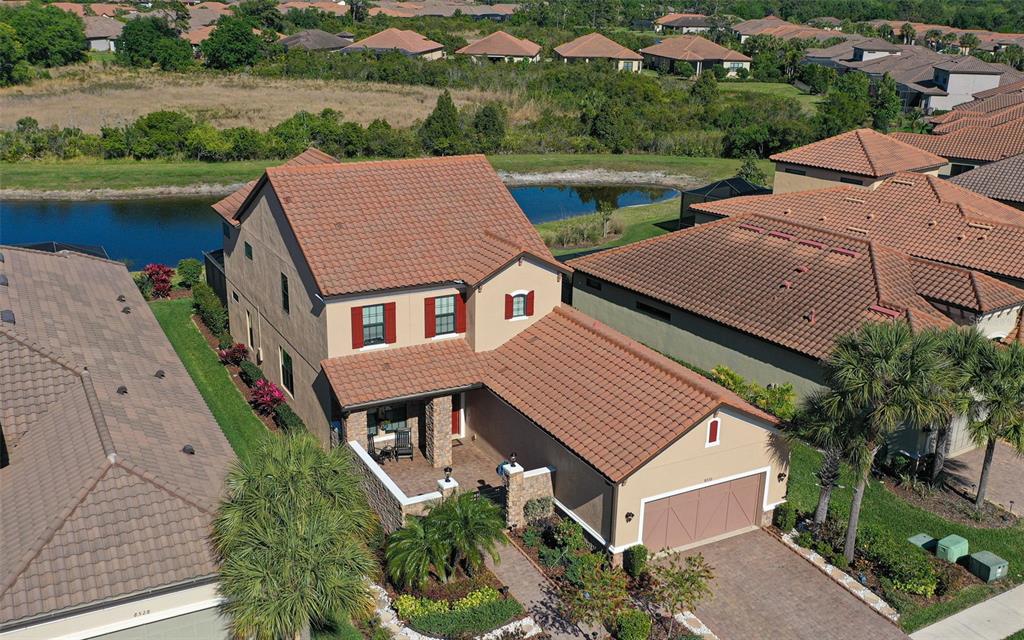 8530 Grand Alberato Road Tampa, FL 33647 - Photo 49 of 67 an aerial view of a house with a yard