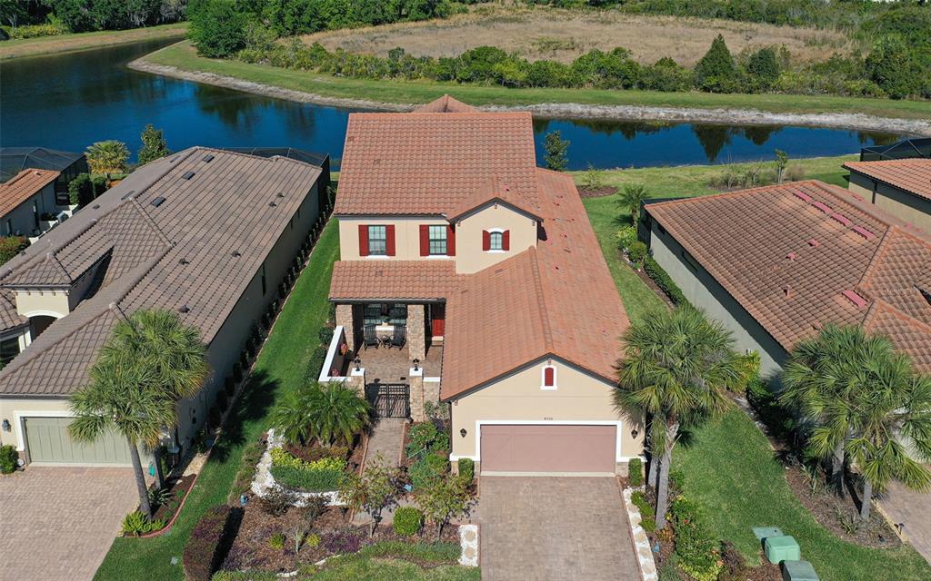 8530 Grand Alberato Road Tampa, FL 33647 - Photo 50 of 67 an aerial view of multiple houses with a yard