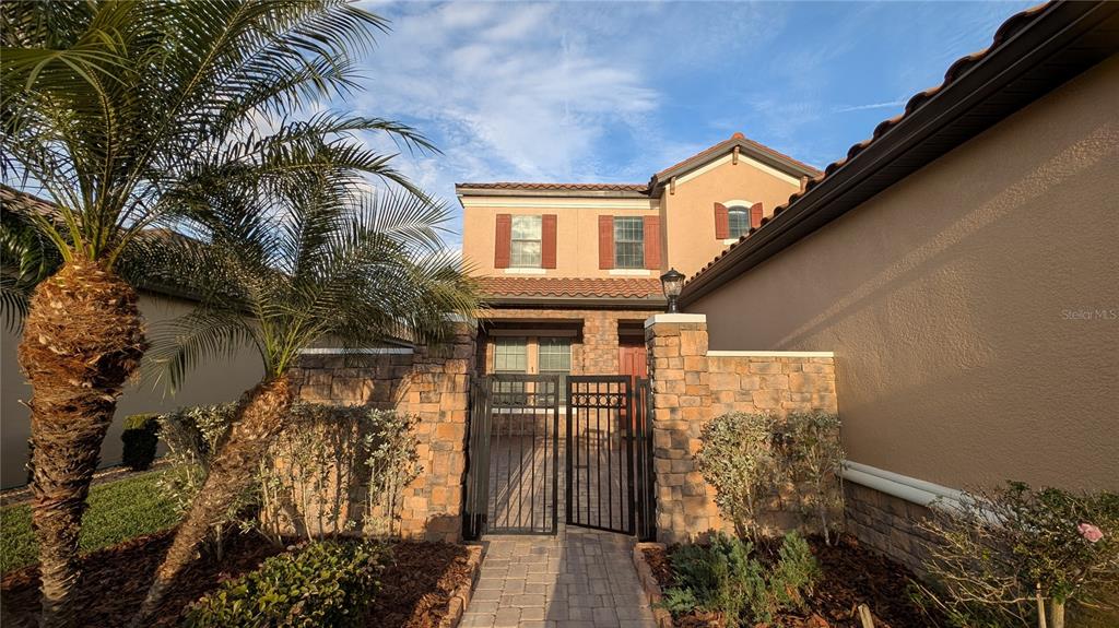 8530 Grand Alberato Road Tampa, FL 33647 - Photo 5 of 67 a front view of a house with a yard