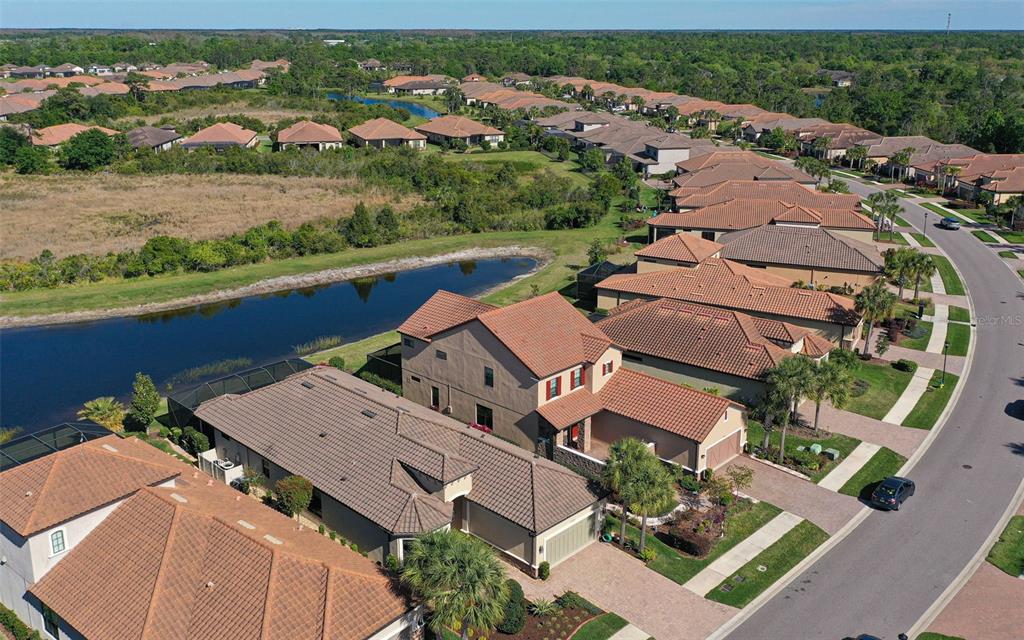 8530 Grand Alberato Road Tampa, FL 33647 - Photo 52 of 67 an aerial view of a house with a lake view