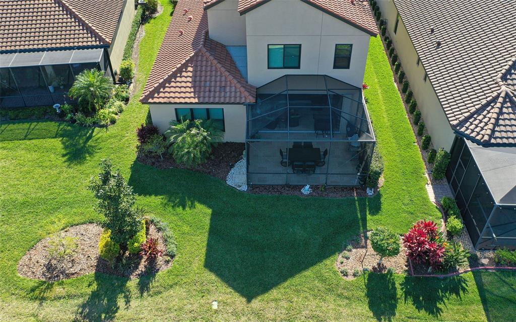 8530 Grand Alberato Road Tampa, FL 33647 - Photo 57 of 67 a front view of a house with a yard
