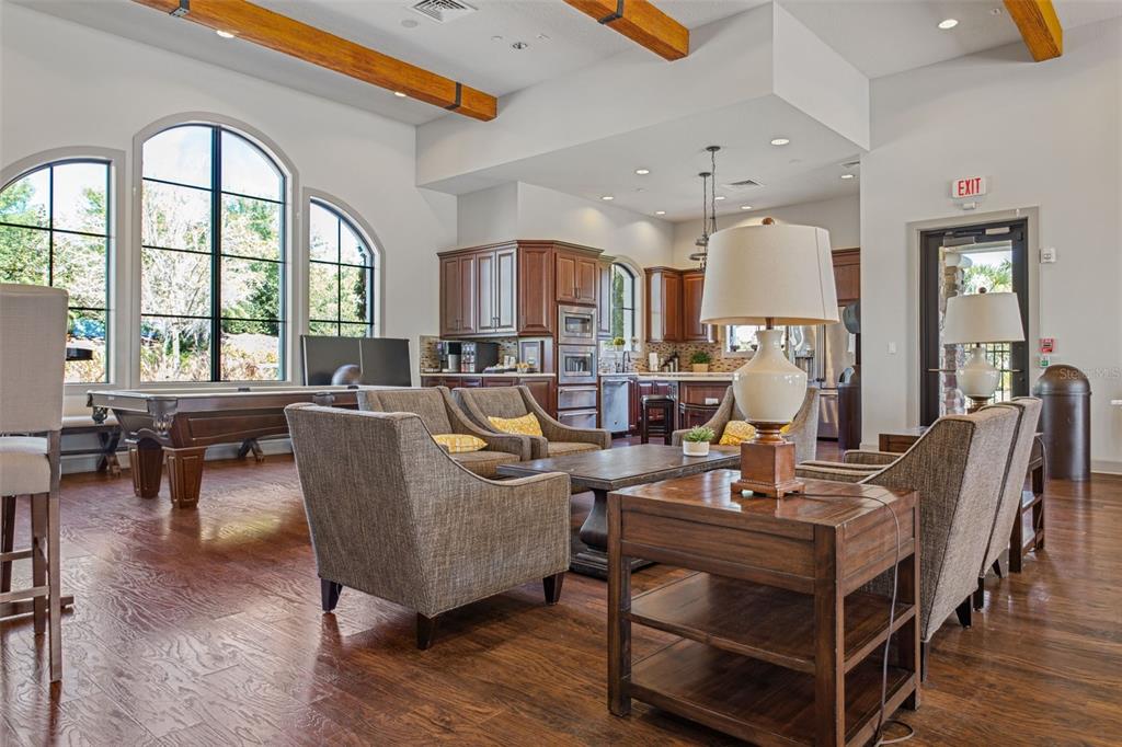 8530 Grand Alberato Road Tampa, FL 33647 - Photo 60 of 67 a living room with furniture a table and large windows