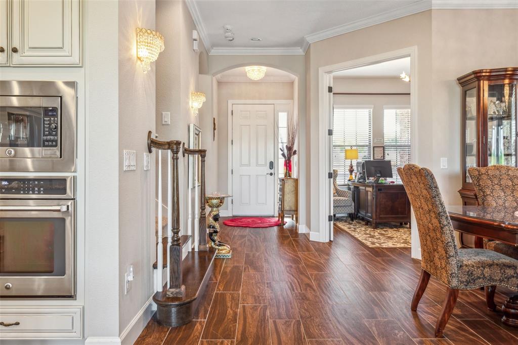 8530 Grand Alberato Road Tampa, FL 33647 - Photo 7 of 67 a dining room with furniture and wooden floor