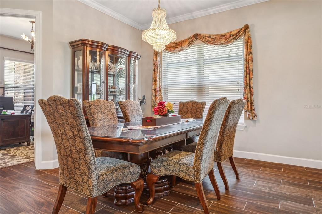 8530 Grand Alberato Road Tampa, FL 33647 - Photo 9 of 67 a view of a dining room with furniture window and wooden floor