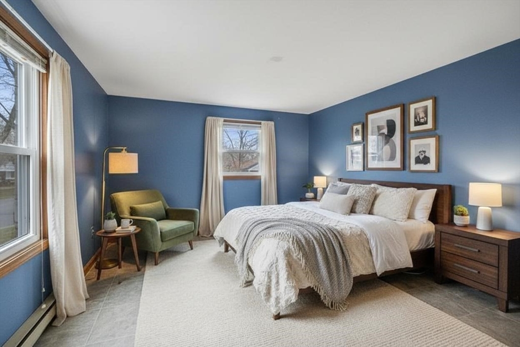 15 Cumberland Street Worcester, MA 01606 - Photo 11 of 35 a spacious bedroom with a bed and window