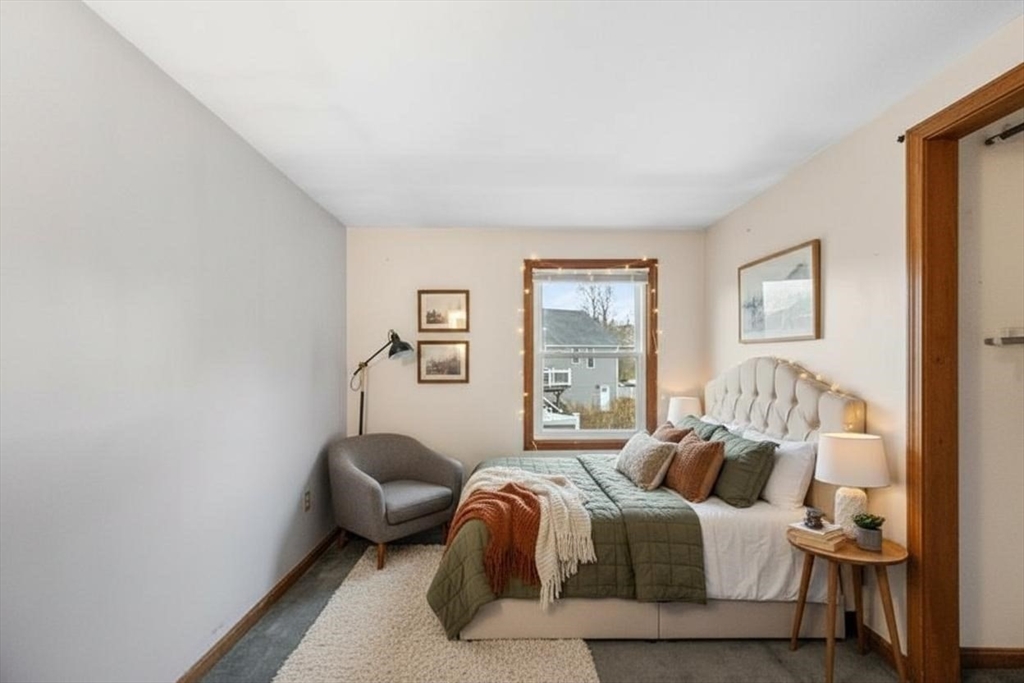 15 Cumberland Street Worcester, MA 01606 - Photo 14 of 35 a bedroom with a bed and a couch