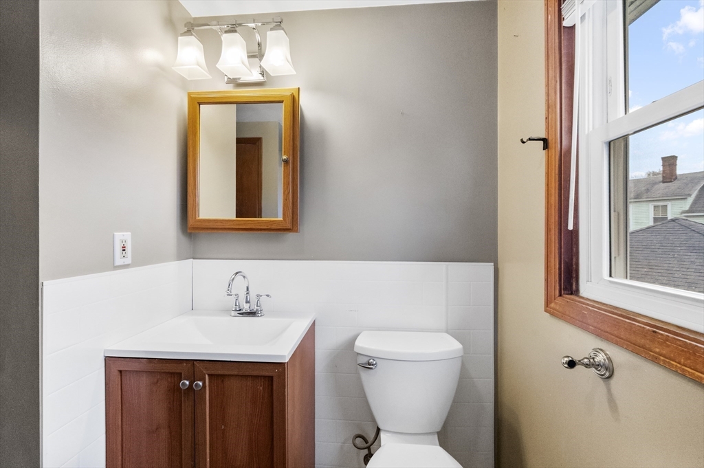 15 Cumberland Street Worcester, MA 01606 - Photo 18 of 35 a bathroom with a toilet sink and mirror
