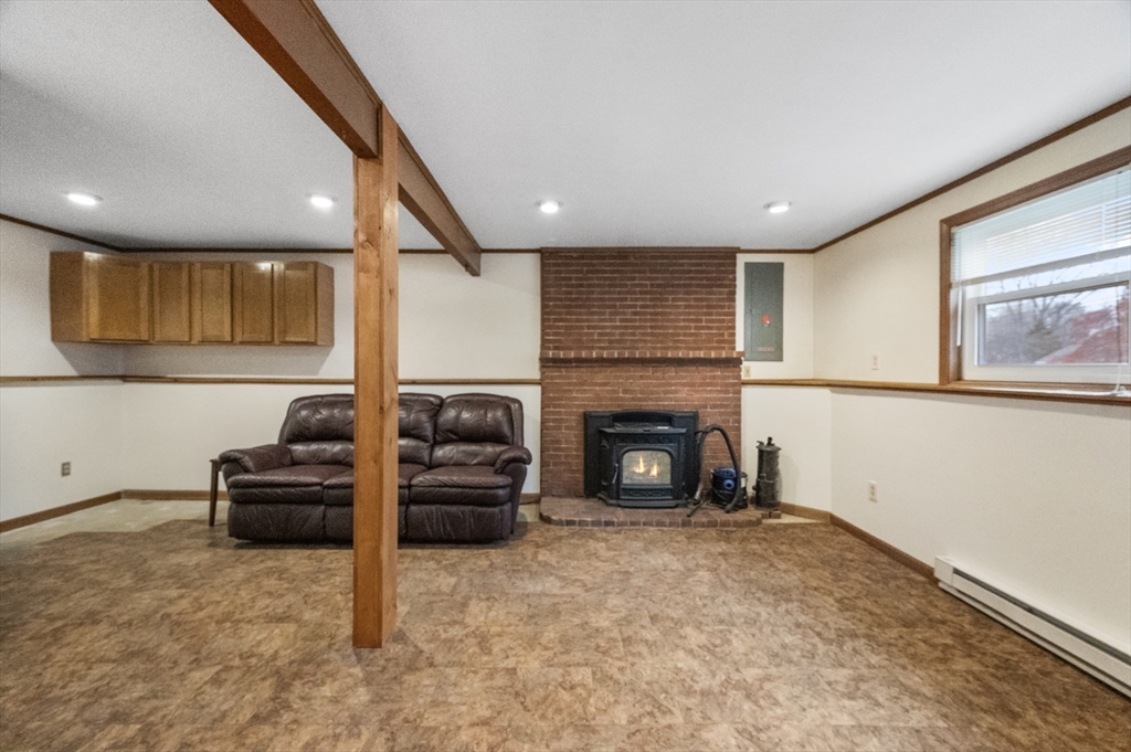 15 Cumberland Street Worcester, MA 01606 - Photo 19 of 35 a living room with furniture and a fireplace