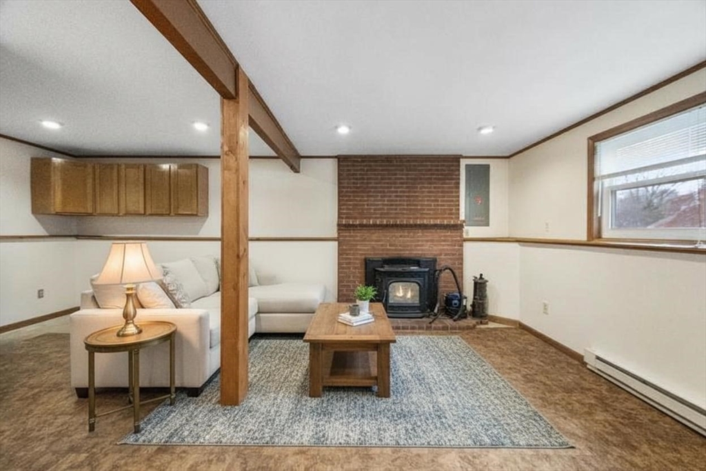 15 Cumberland Street Worcester, MA 01606 - Photo 20 of 35 a living room with furniture and a fireplace