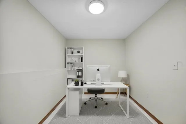 a view of a house with a wooden deck