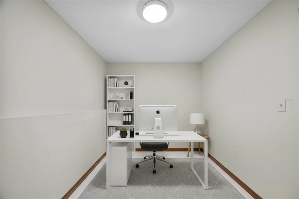 15 Cumberland Street Worcester, MA 01606 - Photo 28 of 35 a room with a chair and white walls