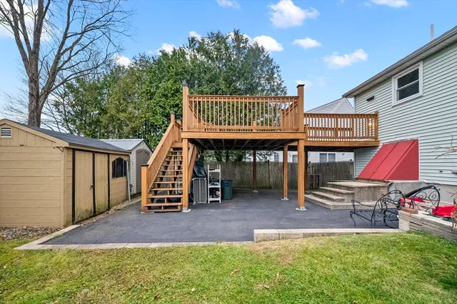 a view of a house with a yard and garage