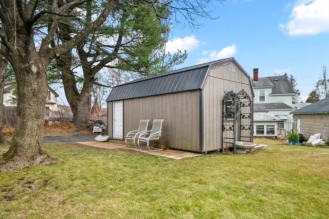 an aerial view of residential house with outdoor space and parking