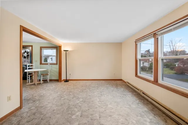 a kitchen with a refrigerator a stove a sink dishwasher with a dining table and chairs