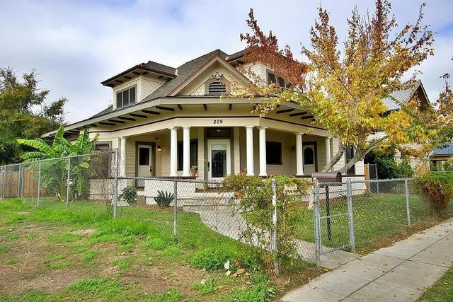 a front view of a house with garden