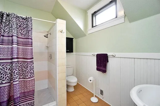 a bathroom with a toilet and a sink