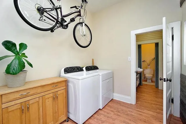 a view of a storage & utility room with wooden floor