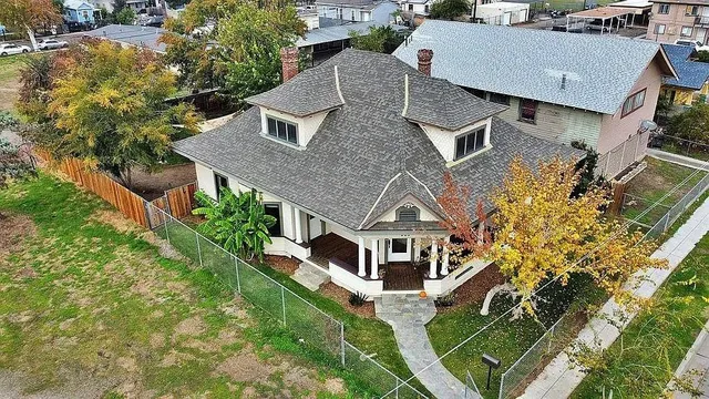 an aerial view of a house with a big yard