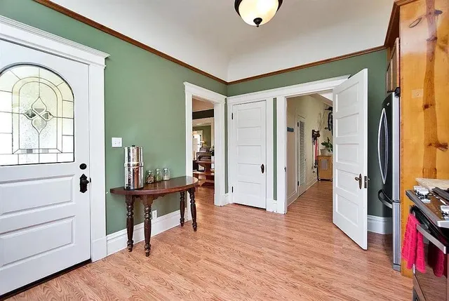a view of a livingroom with furniture and hardwood floor