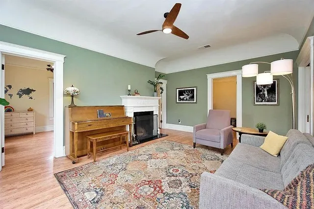 a living room with furniture and a fireplace