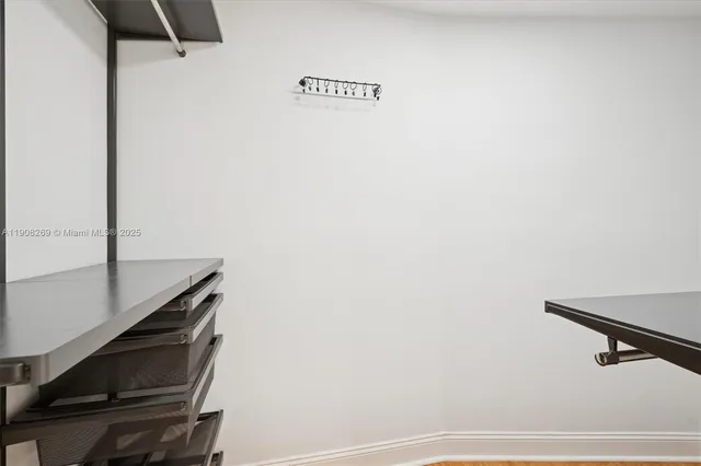 a spacious bathroom with a granite countertop sink and a mirror