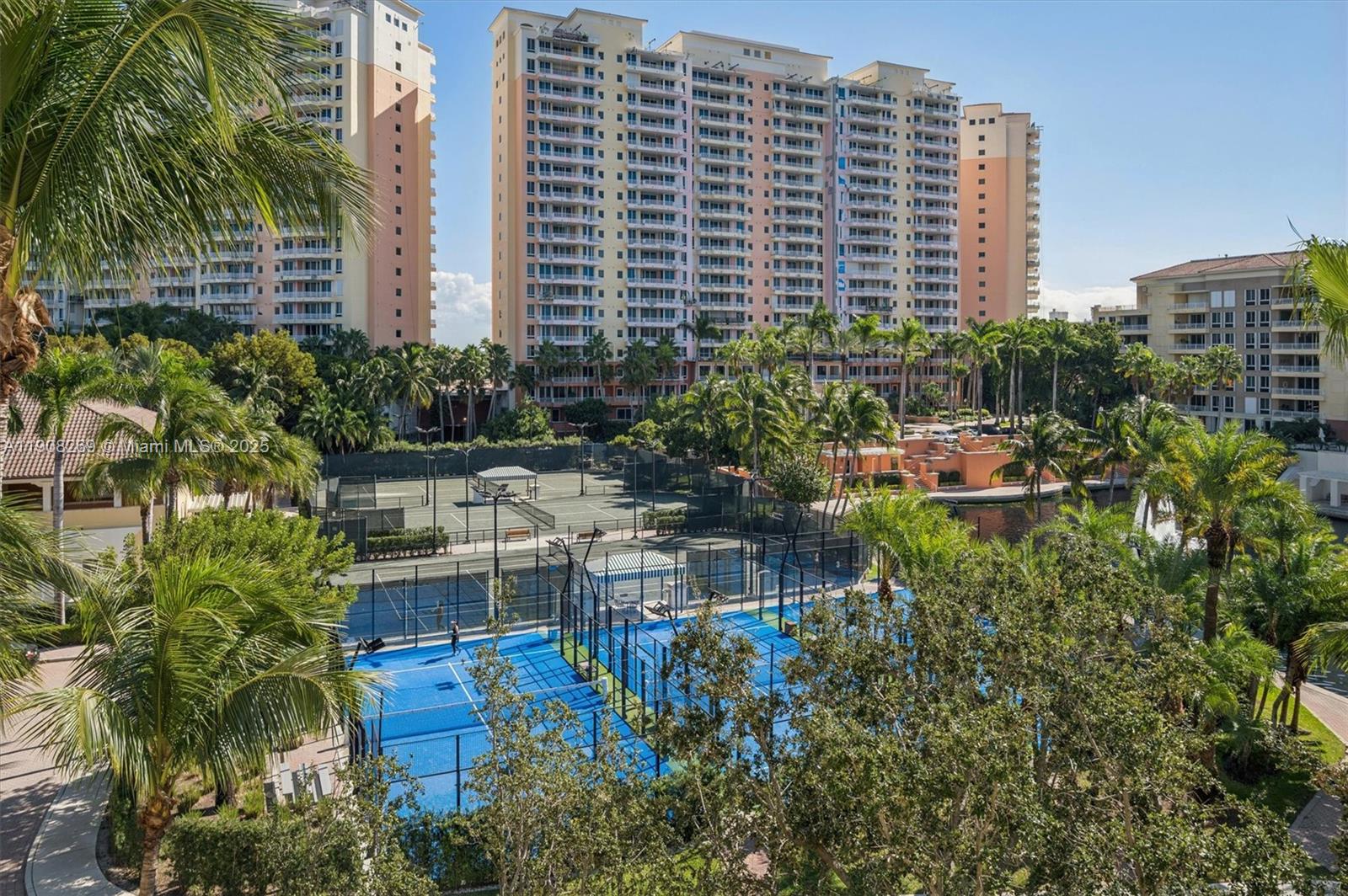 717 Crandon Boulevard, Unit 507 Key Biscayne, FL 33149 - Photo 3 of 27 a backyard of a house with outdoor seating and plants