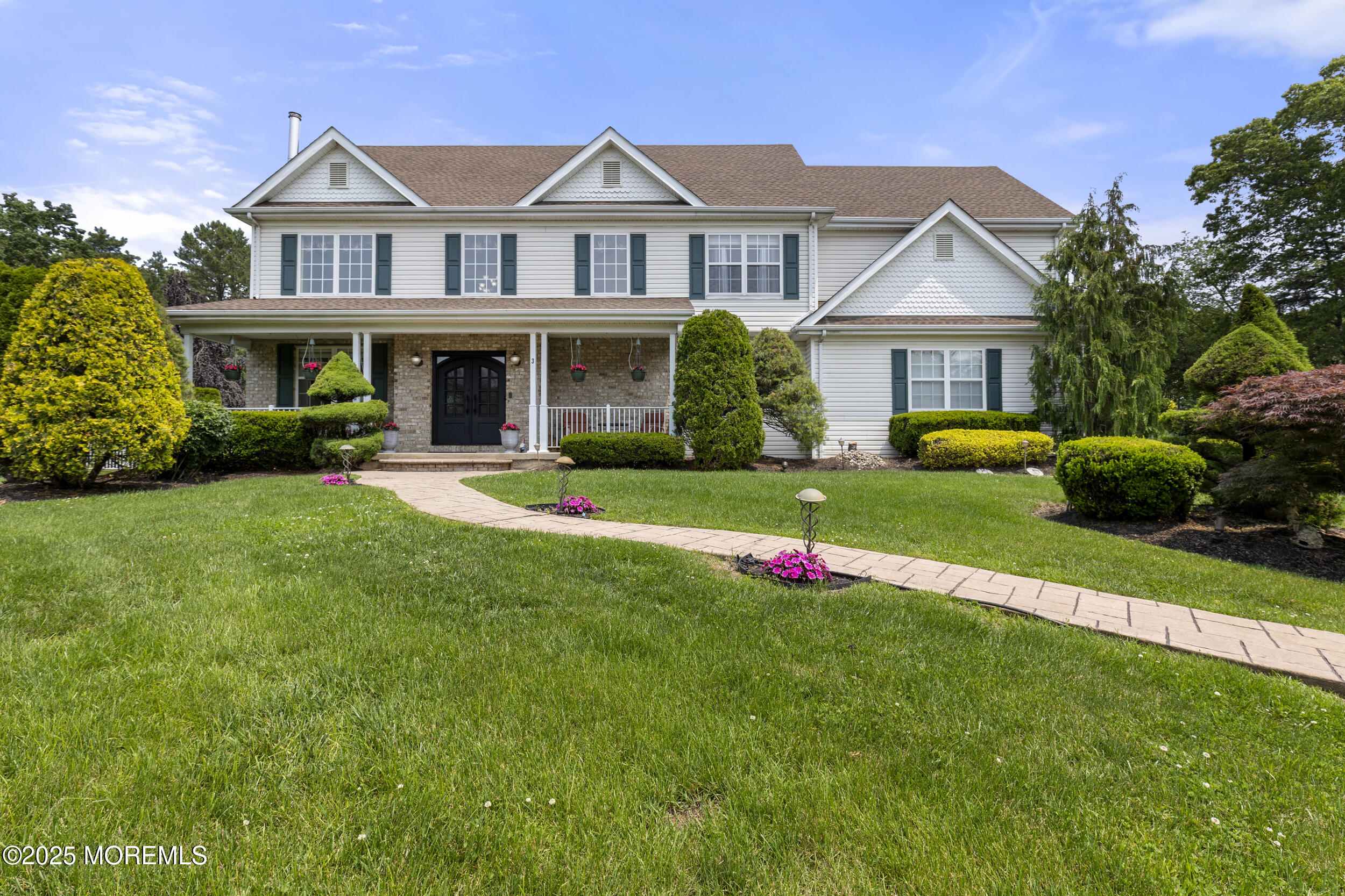 a front view of house with yard and green space