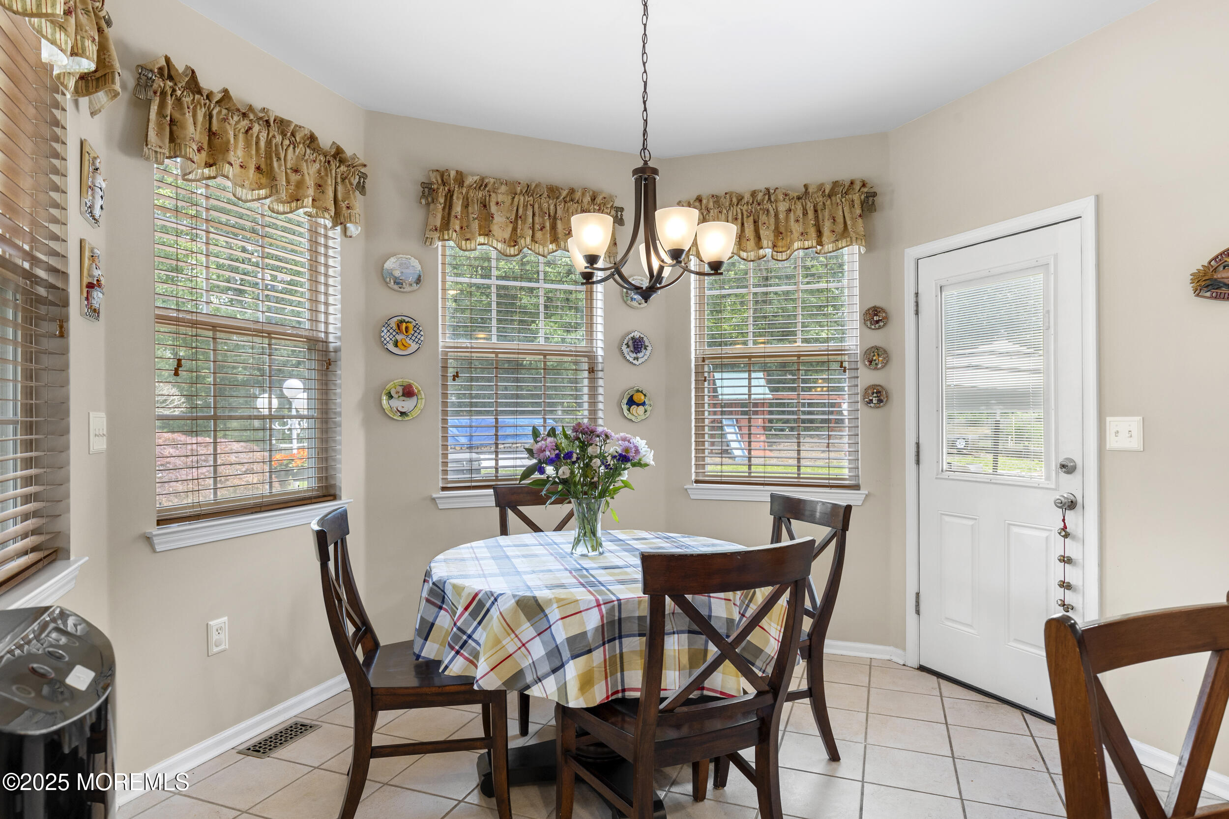 3 Wellesly Court Jackson, NJ 08527 - Photo 20 of 32 a view of a dining room with furniture large windows and wooden floor