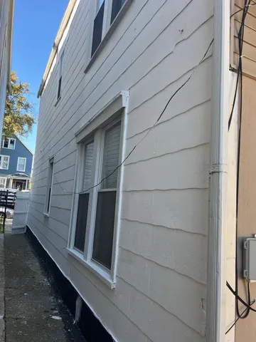 a backyard of a house with seating space