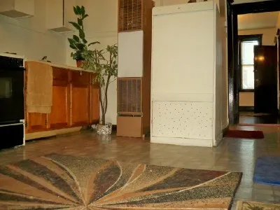 a view of a room with wooden floor