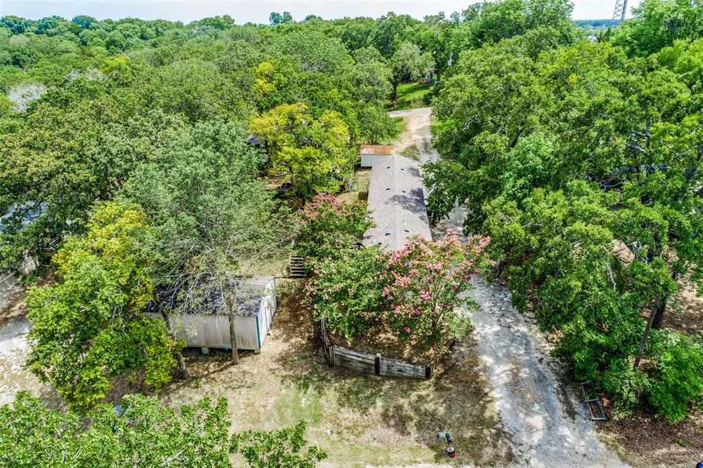 28 Wembley Road Gordonville, TX 76245 - Photo 16 of 24 Aerial view of home with driveway spanning the distance between 2 streets, Epsom and Wembley.