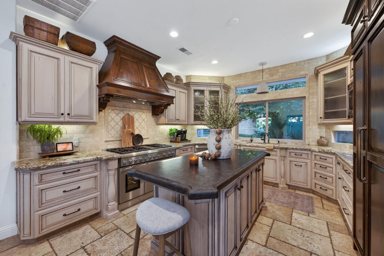 601 Decatur Avenue Clovis, CA 93611 - Photo 14 of 62 a kitchen with granite countertop a sink stove and cabinets