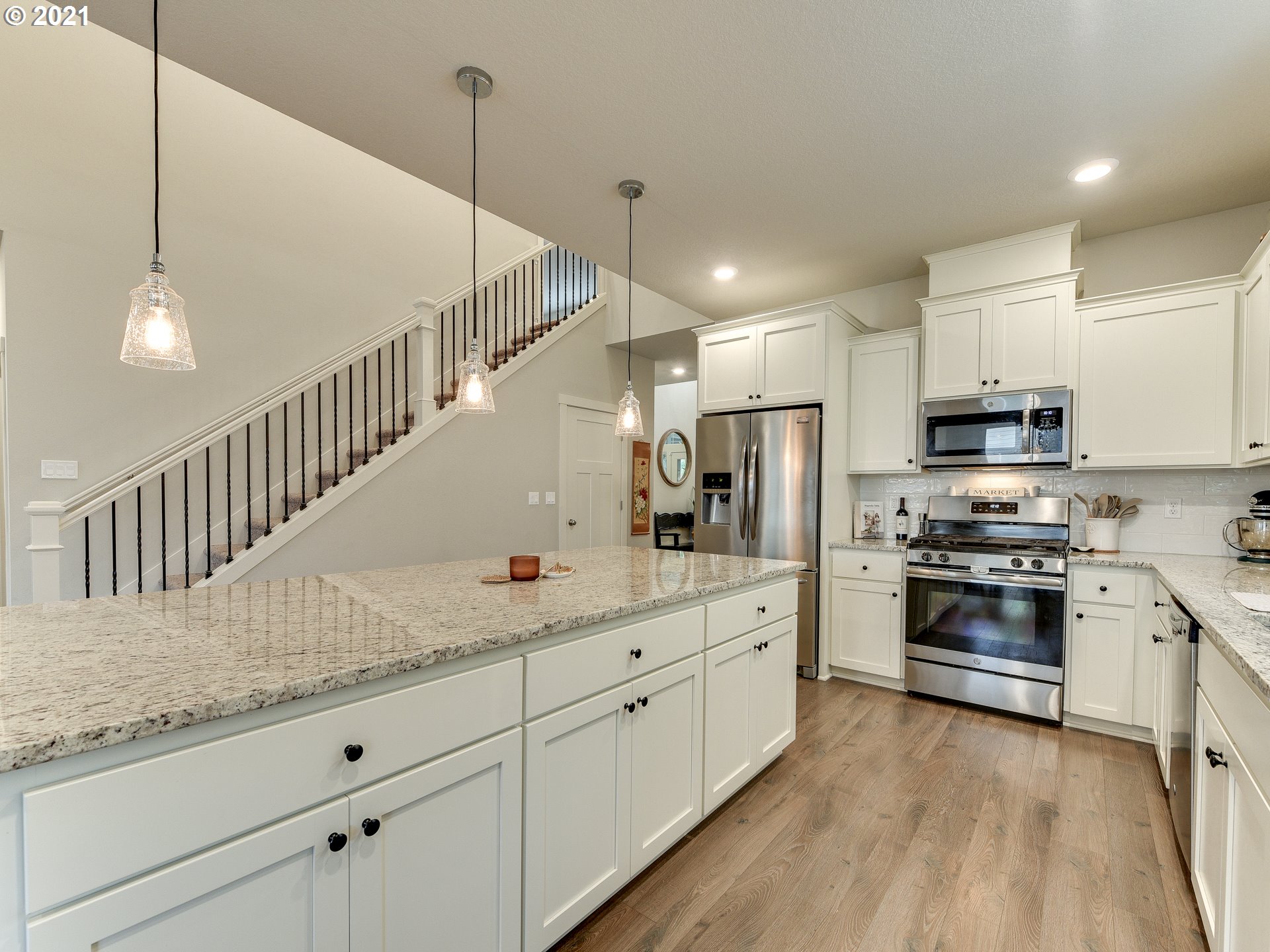 4139 Southwest Rodlun Road Gresham, OR 97080 - Photo 13 of 32 a kitchen with granite countertop a sink stainless steel appliances and cabinets