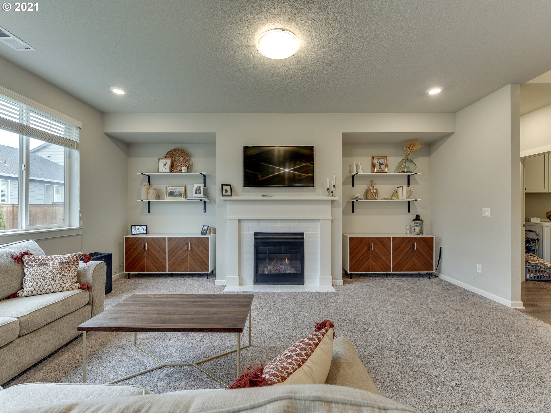 4139 Southwest Rodlun Road Gresham, OR 97080 - Photo 17 of 32 a living room with furniture and a flat screen tv