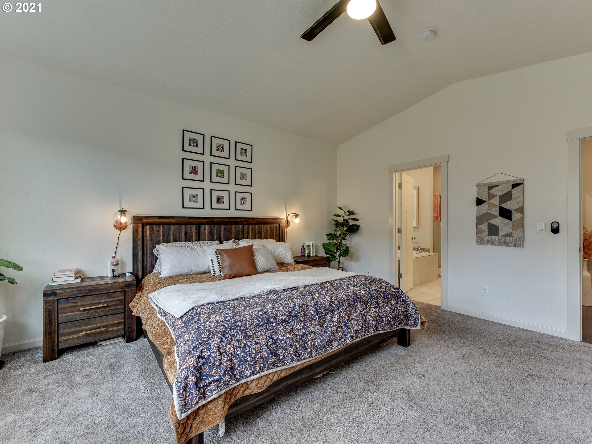 4139 Southwest Rodlun Road Gresham, OR 97080 - Photo 23 of 32 a bedroom with a bed and a chandelier