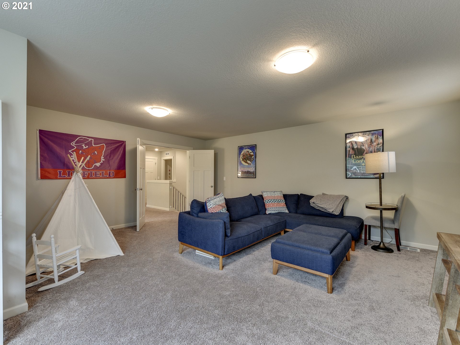 4139 Southwest Rodlun Road Gresham, OR 97080 - Photo 27 of 32 a living room with furniture and a wooden floor