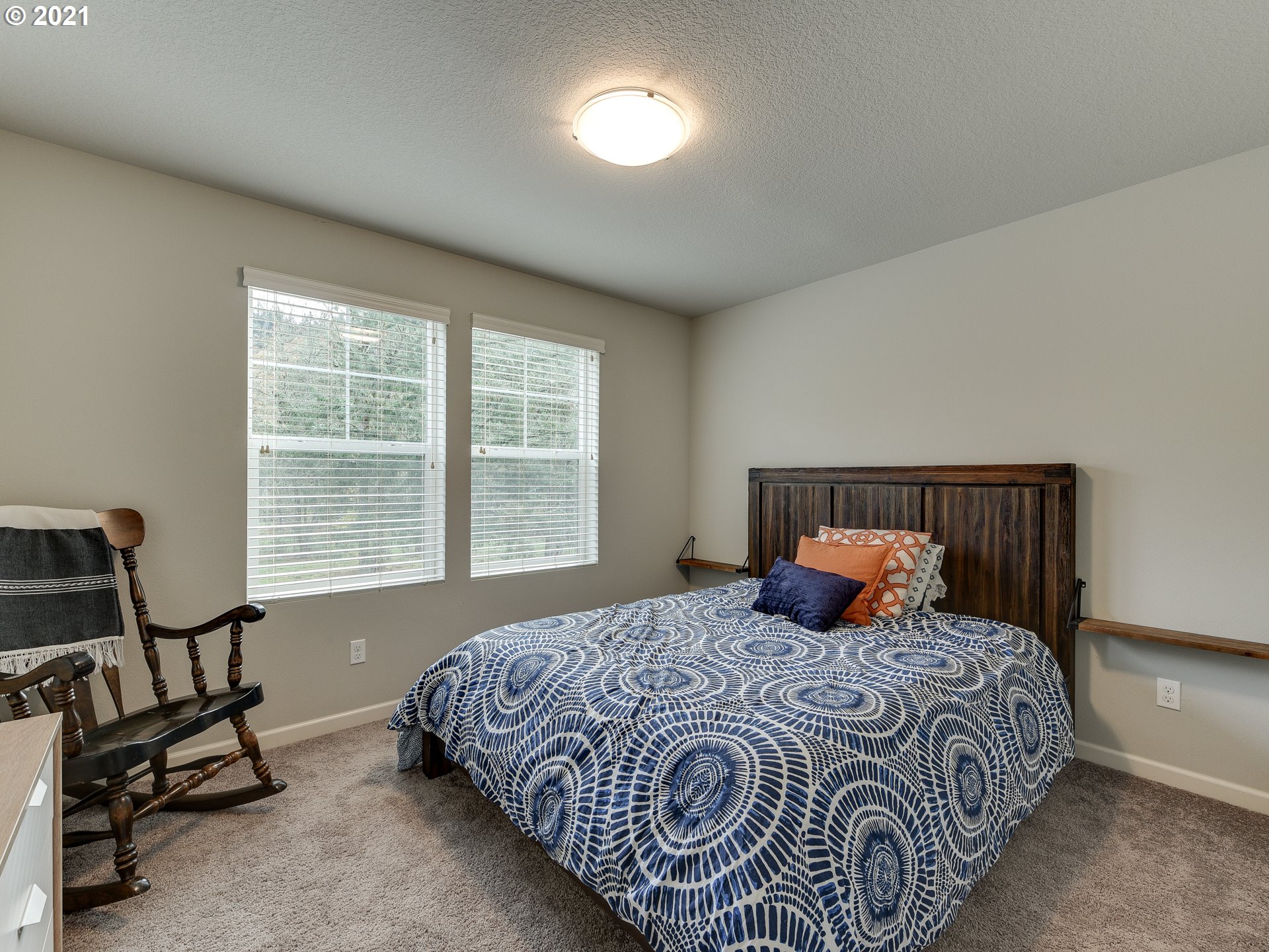4139 Southwest Rodlun Road Gresham, OR 97080 - Photo 28 of 32 a bedroom with a bed a couch and a window