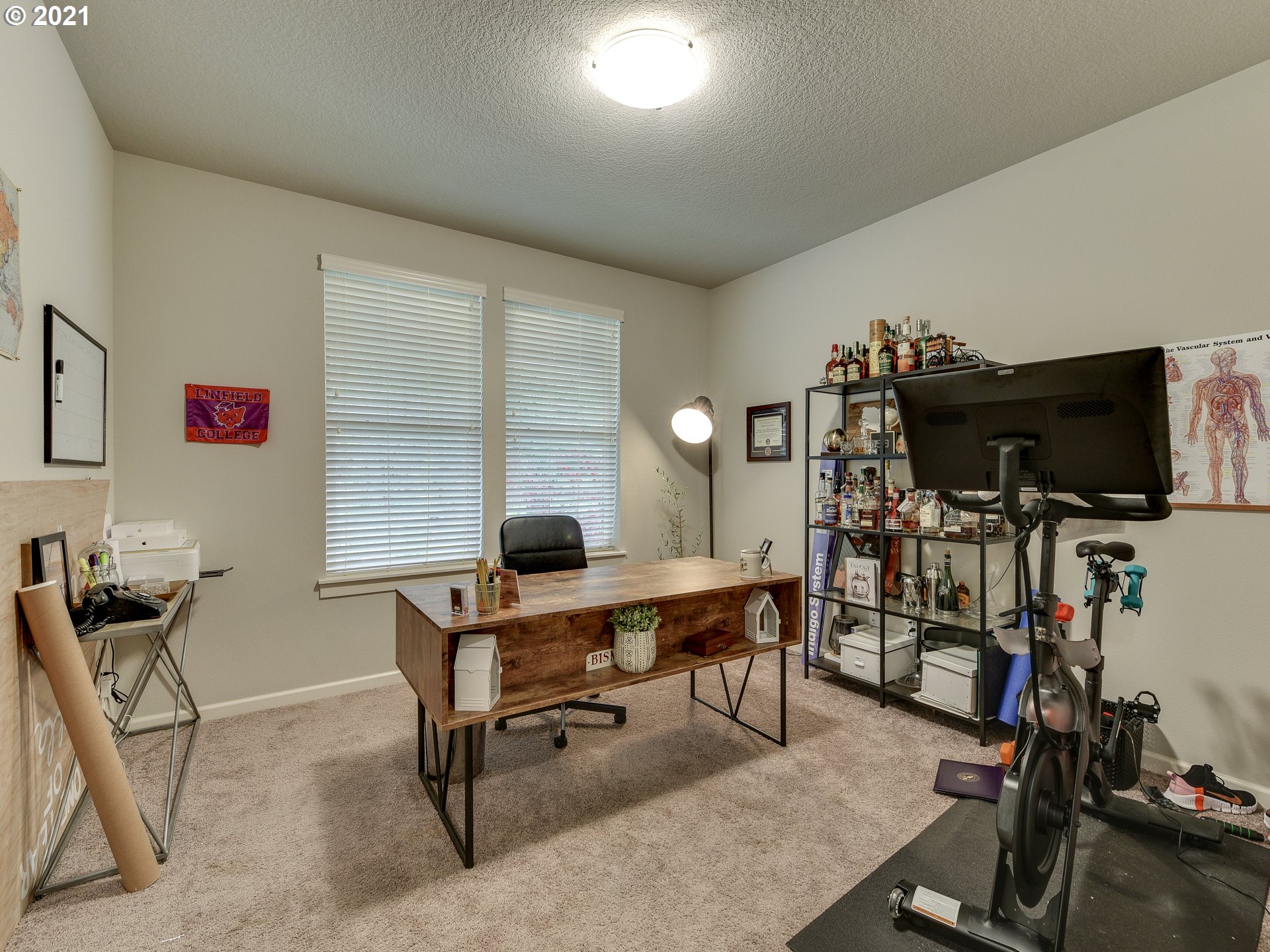 4139 Southwest Rodlun Road Gresham, OR 97080 - Photo 5 of 32 a view of a workspace with furniture and a window